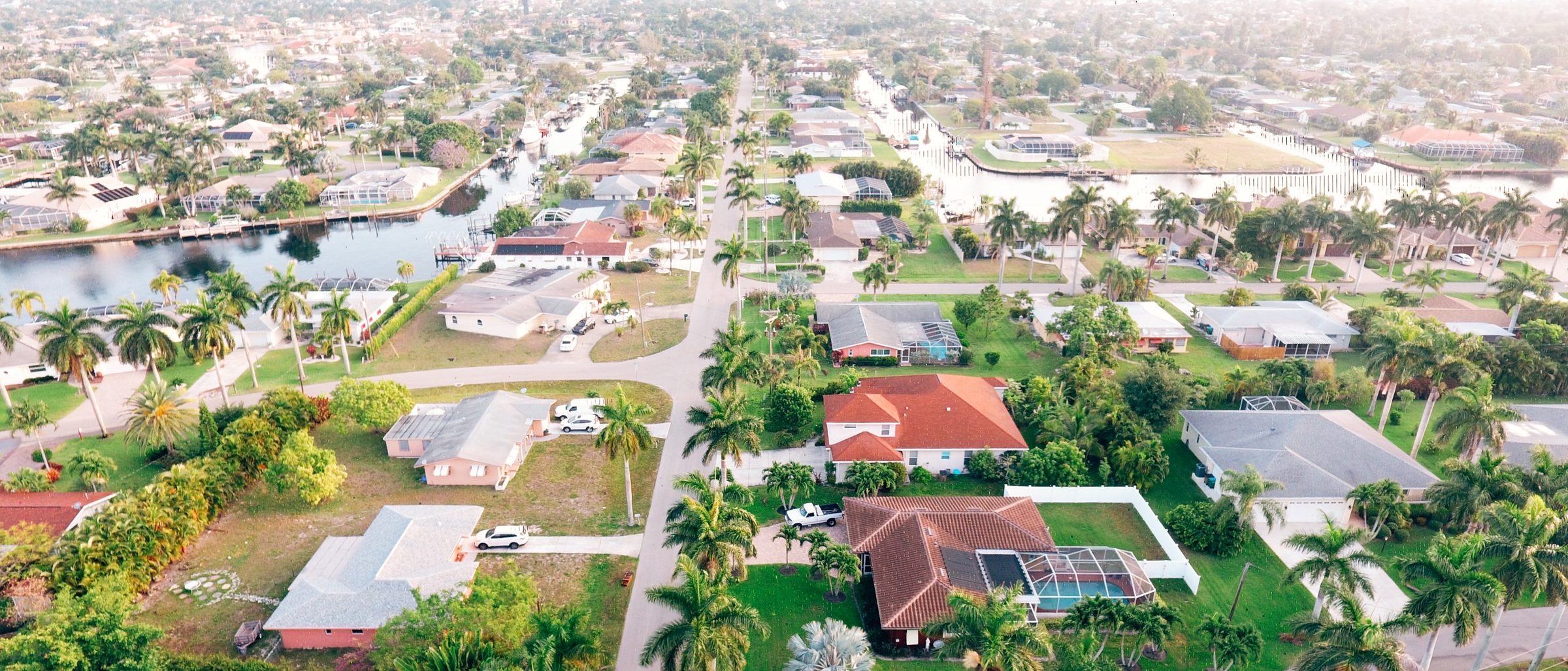 Aerial view of a Florida waterfront neighborhood at golden hour